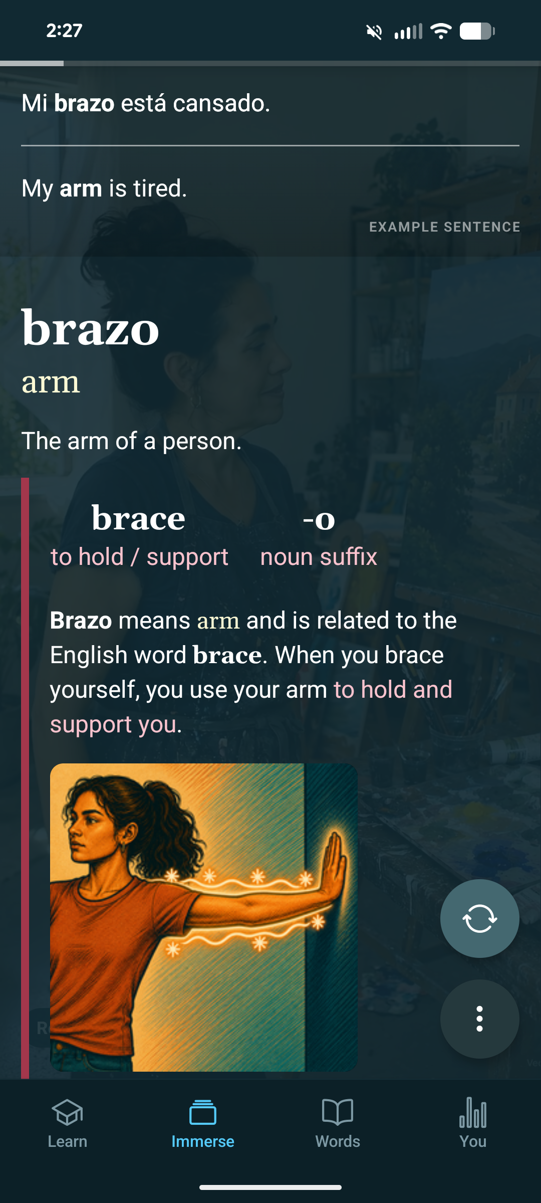 The back of the clip, explaining that brazo means arm and is related to the English word brace.